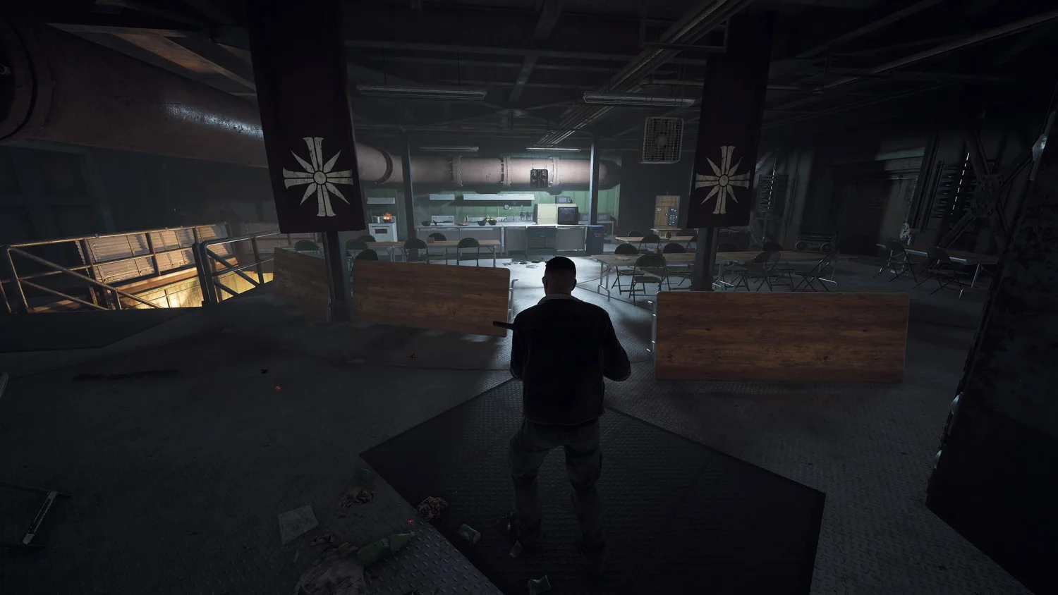 Casualties of War: A screenshot of the bunker interior, showing a kitchen with overturned tables.